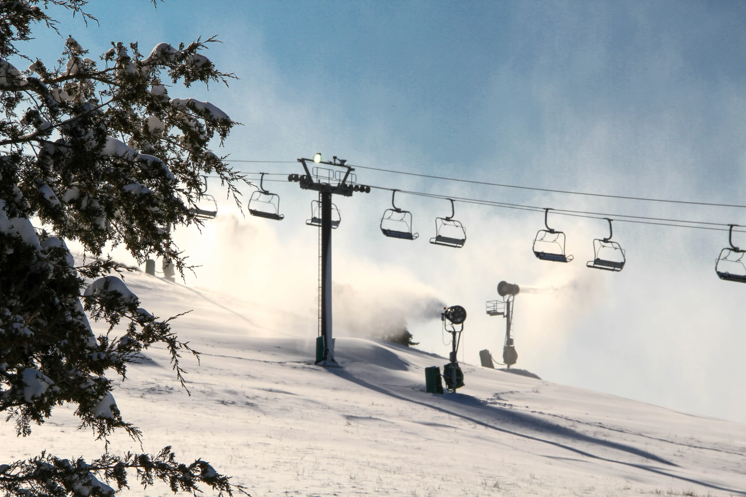 Mt. Brighton chairlift view in the wind with snow.