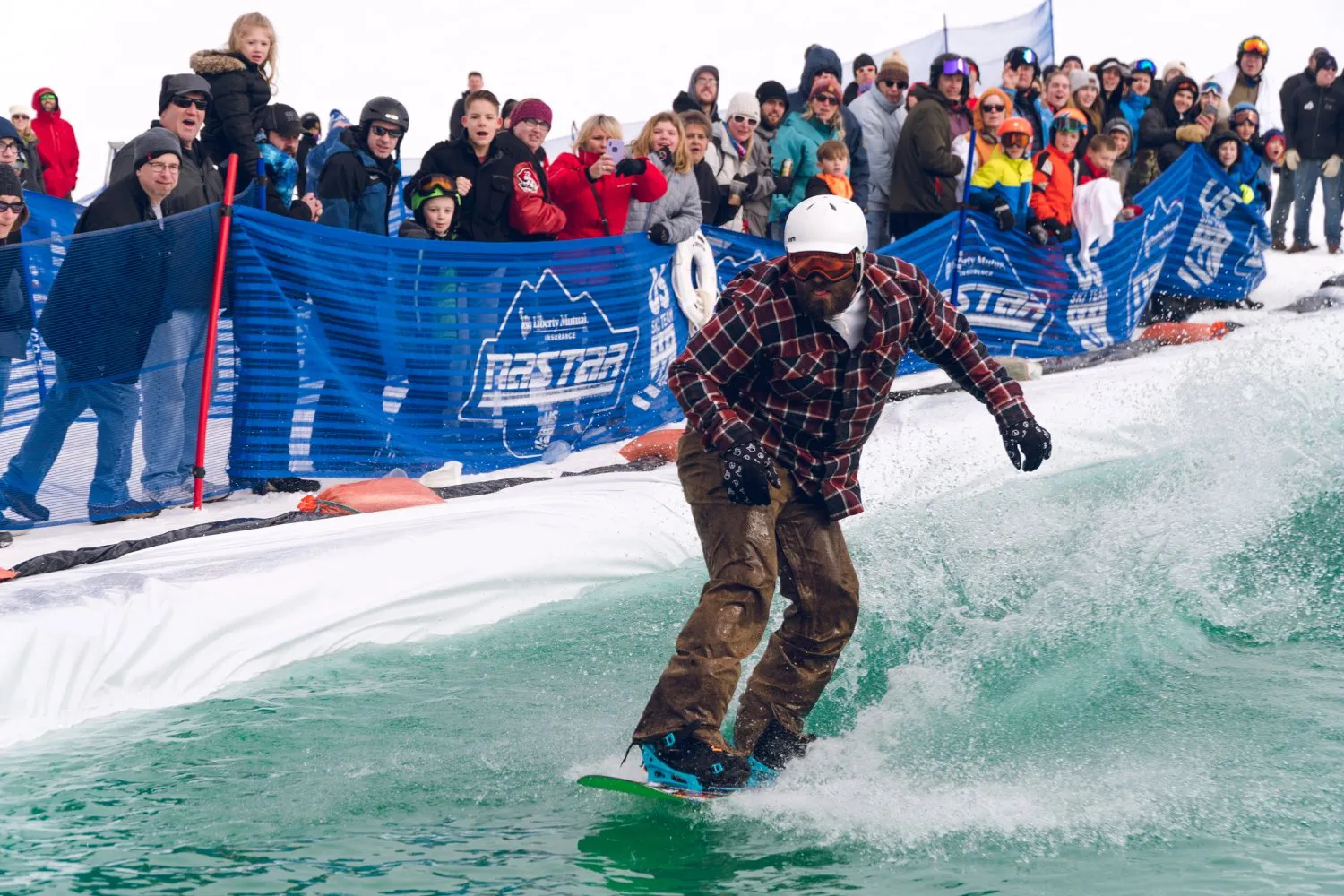 Mt. Brighton slush cup with skier over water.