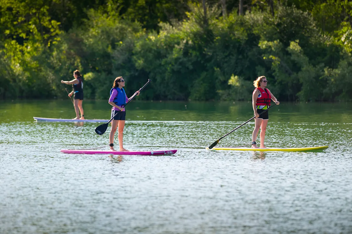 Island Lake Recreation Area paddleboarders on the lake in Brighton, Michigan