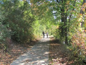 couple walking on trail at Brighton Recreation Area