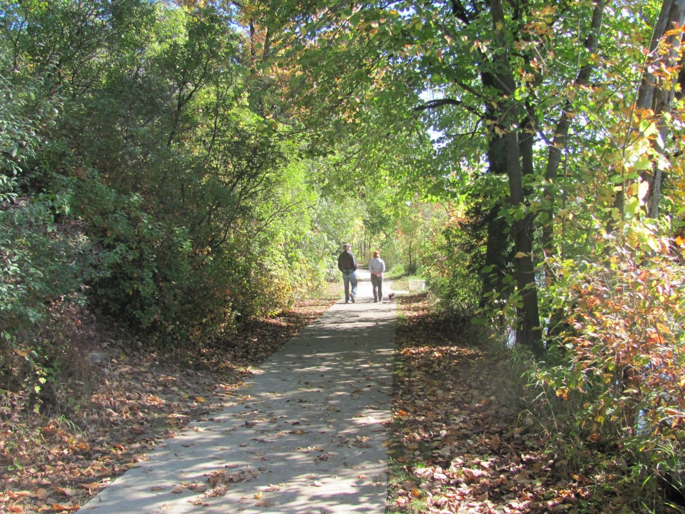 couple walking on trail at Brighton Recreation Area