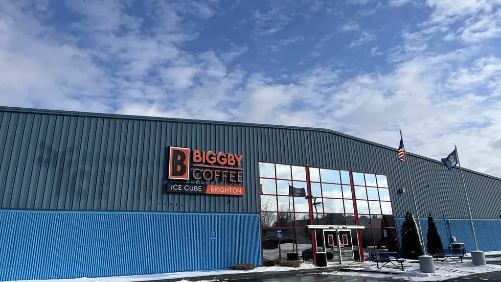 Biggby Coffee Ice Cube Brighton exterior with big sign and mirrored front doors.