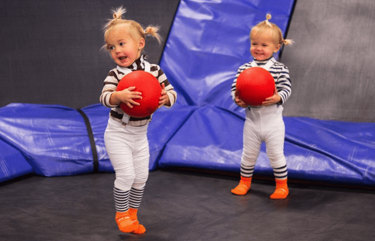 kid twins playing at airborne adventure park