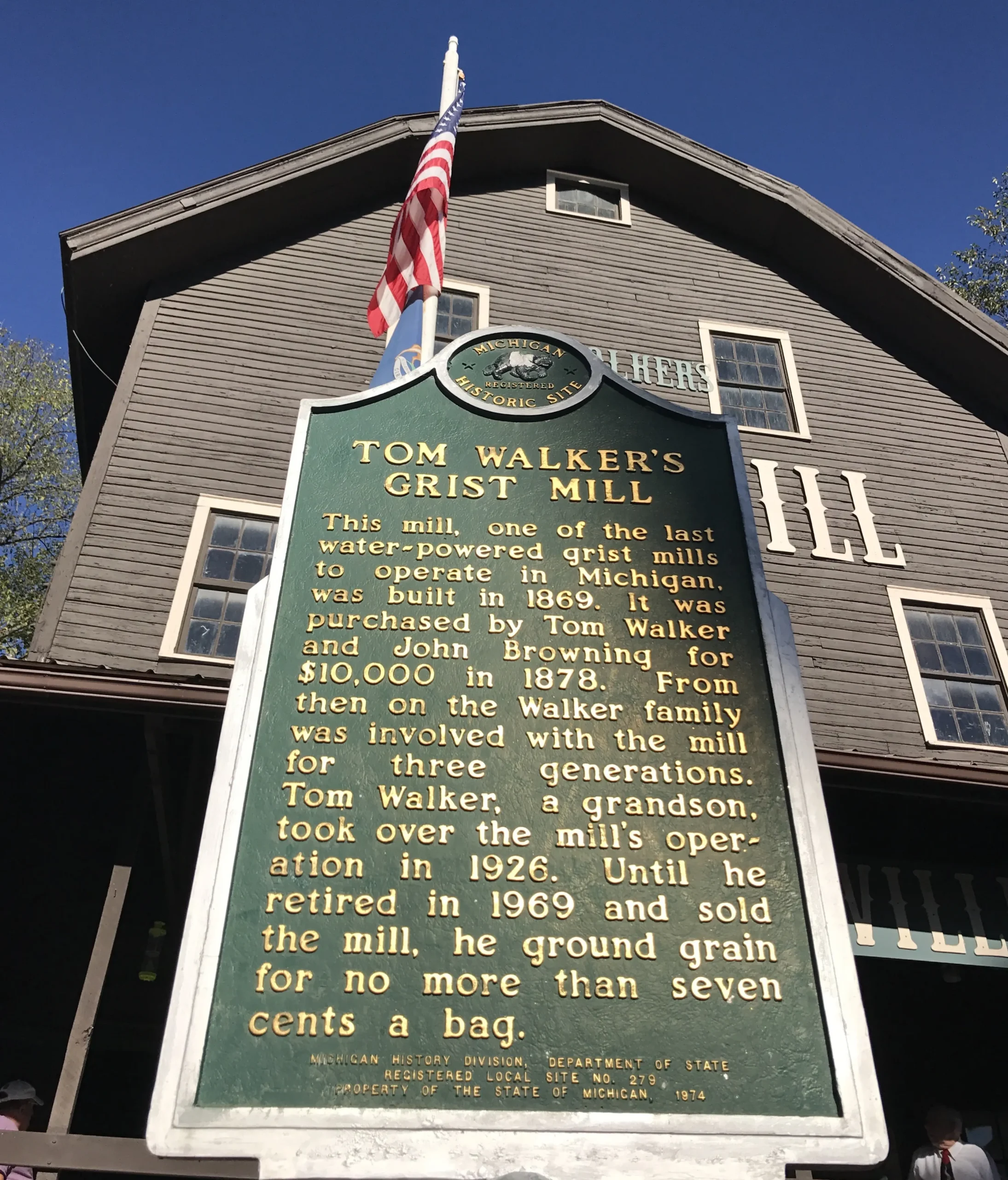 Parshallville Cider Mill historical sign outside grist mill.