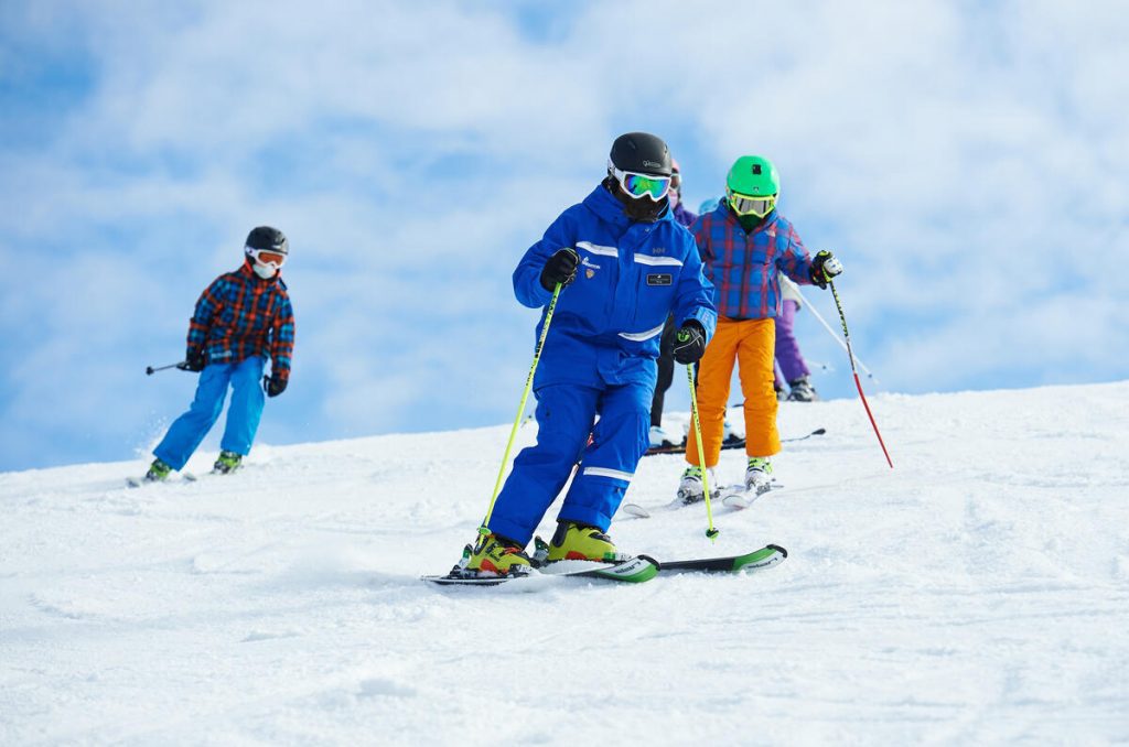 skiiers at mt. brighton on a bluebird day