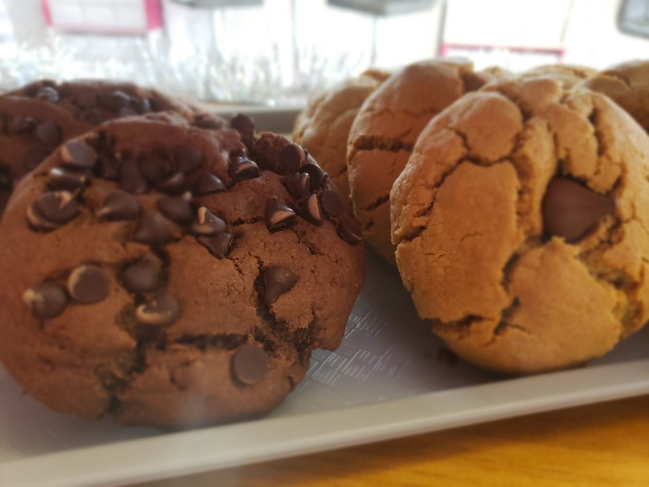 Chocolate and peanut butter cookies in a display case