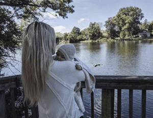 Olivia Monte and her baby at the millpond in Brighton