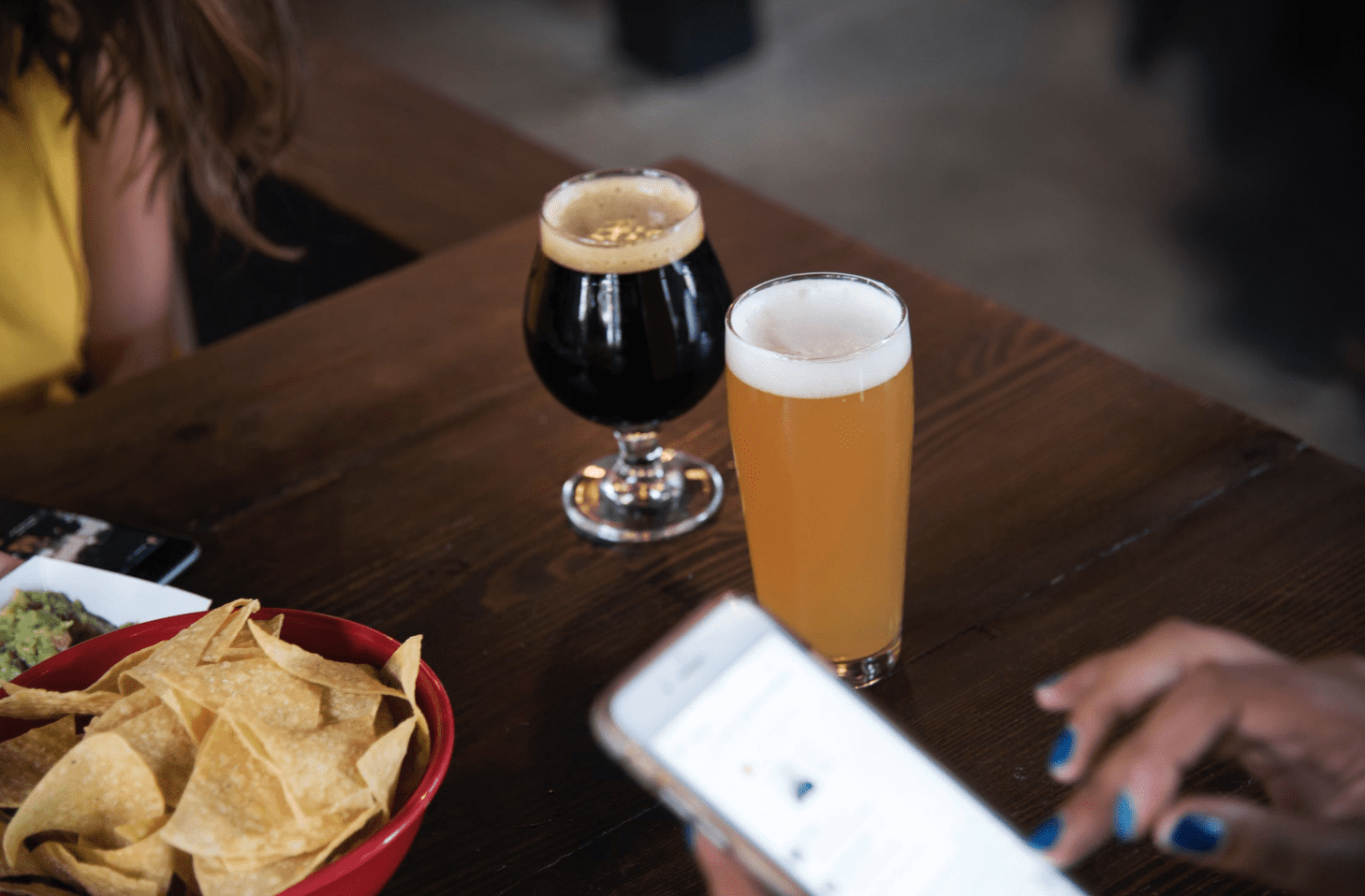 People enjoying dinner with beer