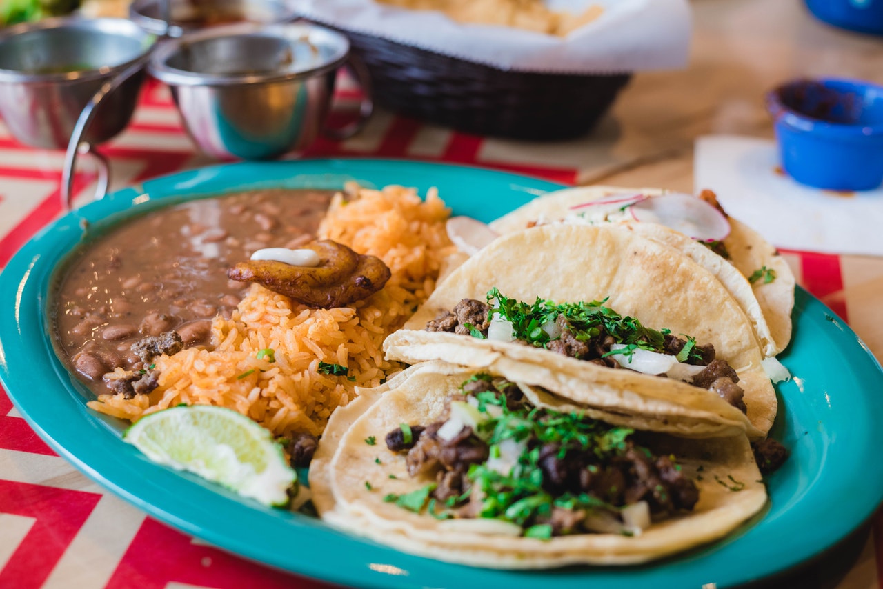 rice and tacos on a blue plate