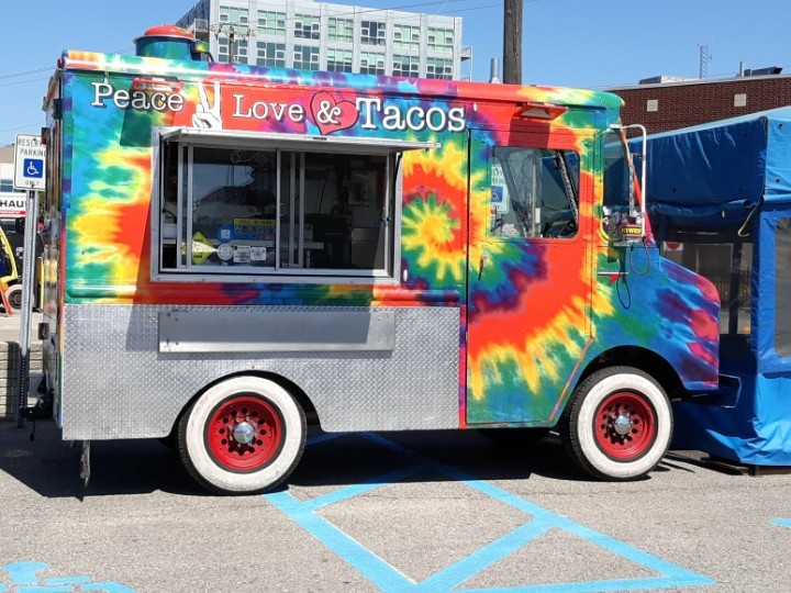 peace love tacos truck at a festival