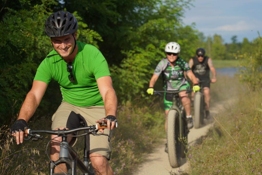 mountain bikers in Island Lake recreation on a sunny summer day in brighton michigan