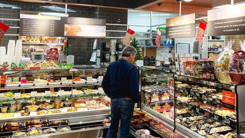 Man at Jonnas Market Deli Counter.