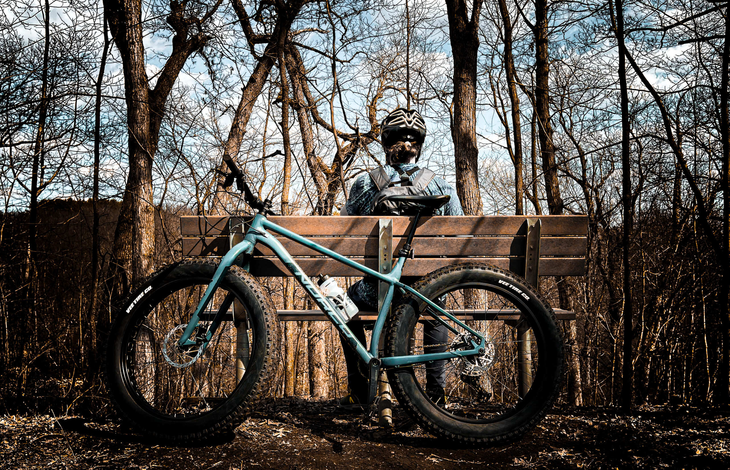 biker taking a rest after a long ride in the island lake state recreation area