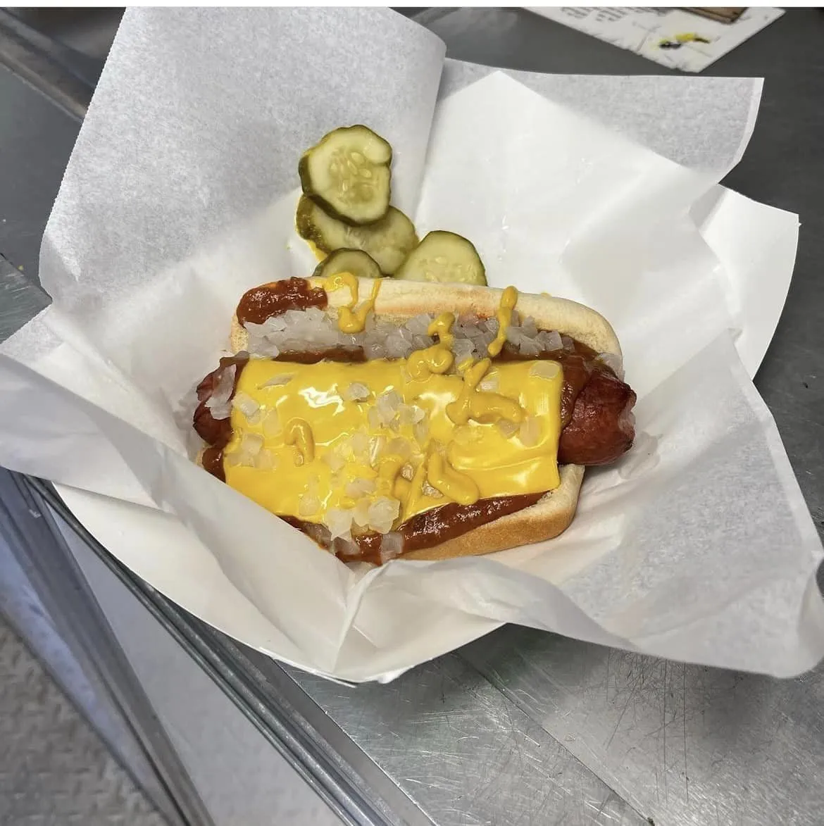 Hot dog decorated with different toppings at Griffs Grill in howell.