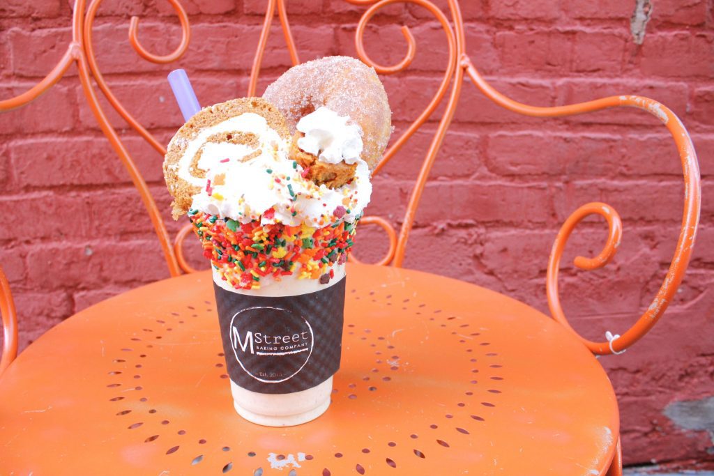 M Street fall milkshake with a cider donut and orange and green sprinkles
