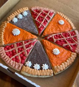 sugar cookies decorated to look like various pies