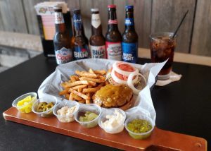 burger and fixings on a serving board