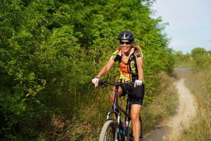 Close up of biker riding on Mike Levine Lakelands Trail
