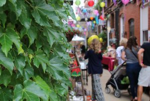 people shopping in alley in downtown Howell