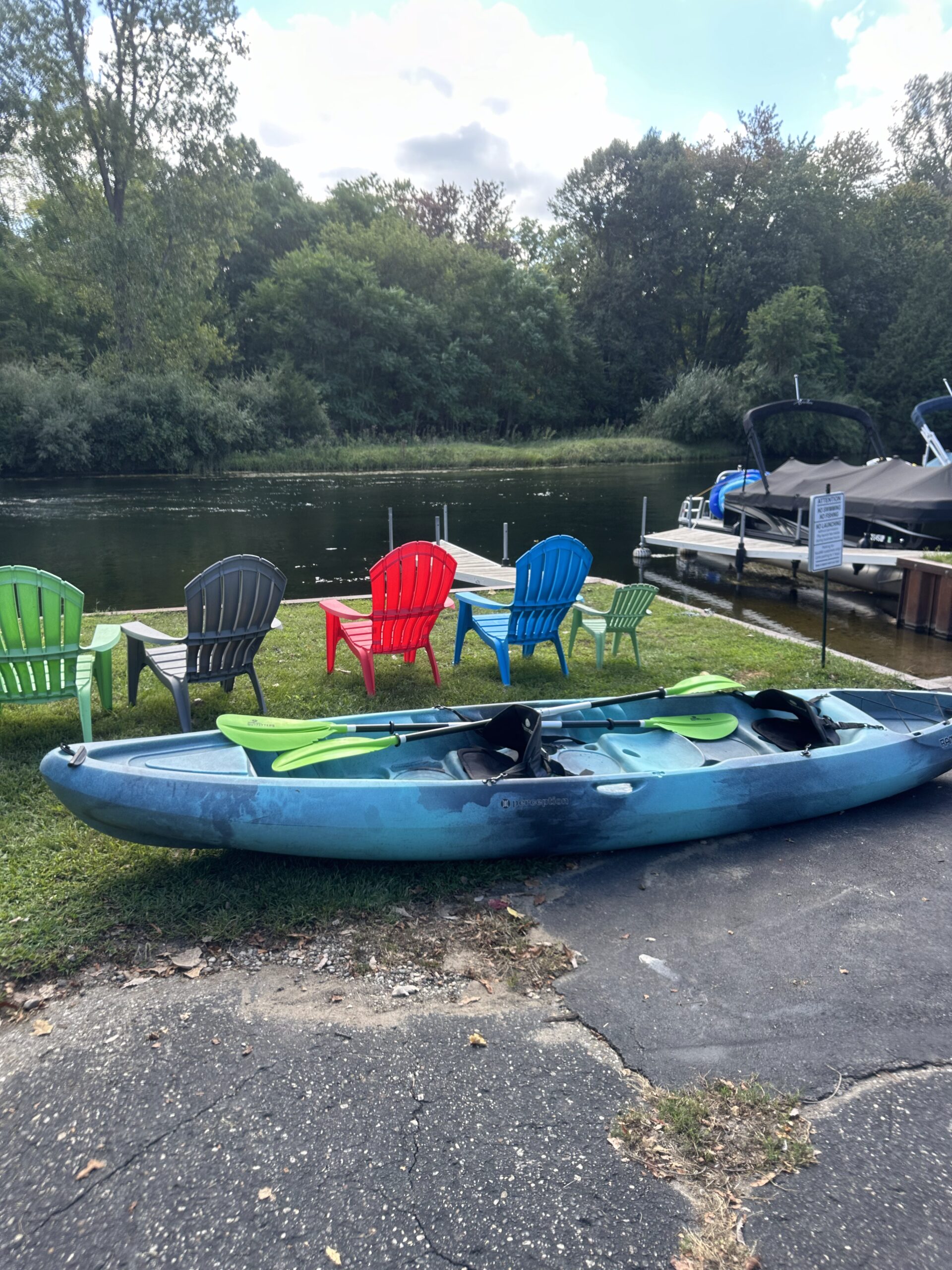NautiMi on the River view of kayak and riverfront seating in Pinckney.