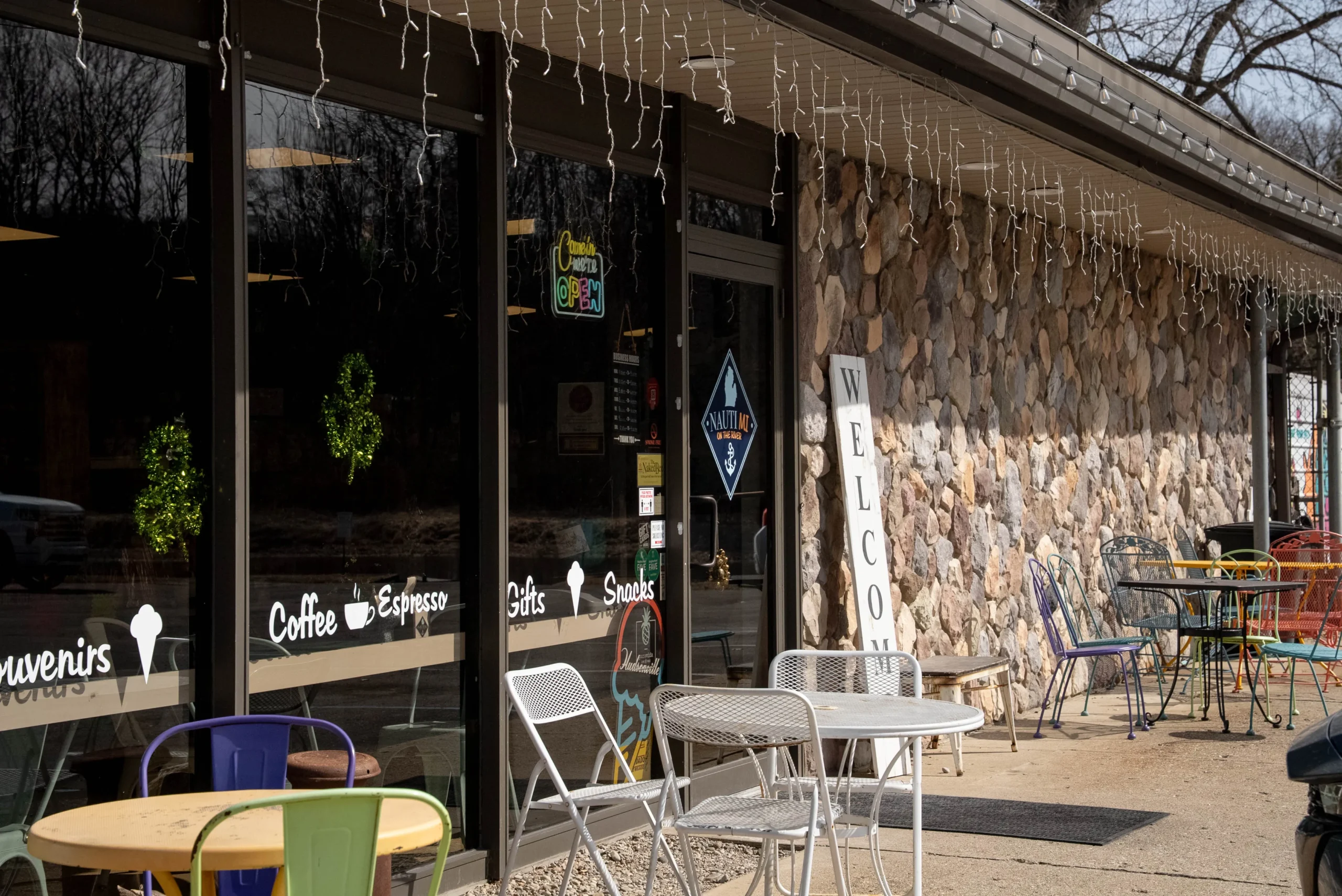 NautiMi on the River front door and outdoor seating in Pinckney.