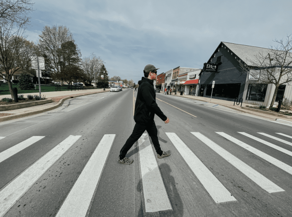 man crossing street
