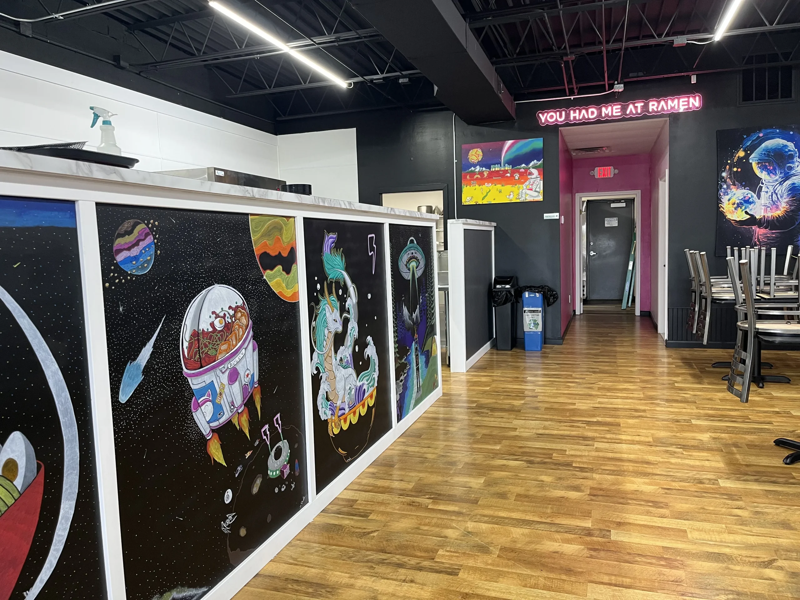 Electric Ramen food counter with murals in restaurant in Brighton