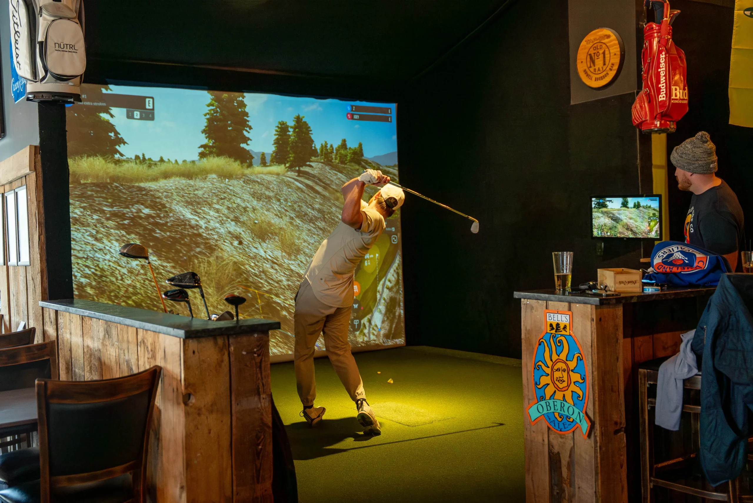 Tap-In's Range indoor golf simulator bay in Howell.