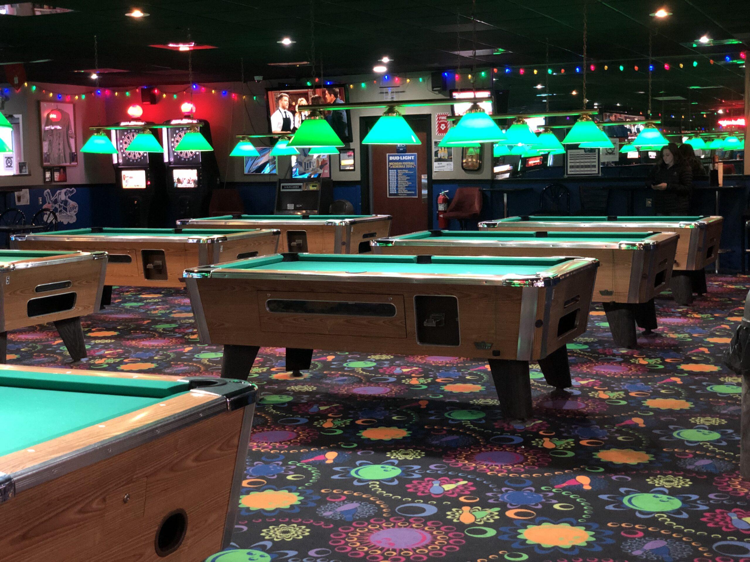 Inside Brighton Bowl billiard tables for people to play