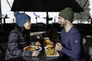 Couple enjoys apres in restaurant in Mt. Brighton, MI.