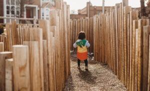 child running through howell summit gardens located in downtown howell