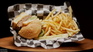 Champs pub burger and fries in a basket on table