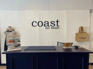Coast on Main check out counter with merchandise surrounding it