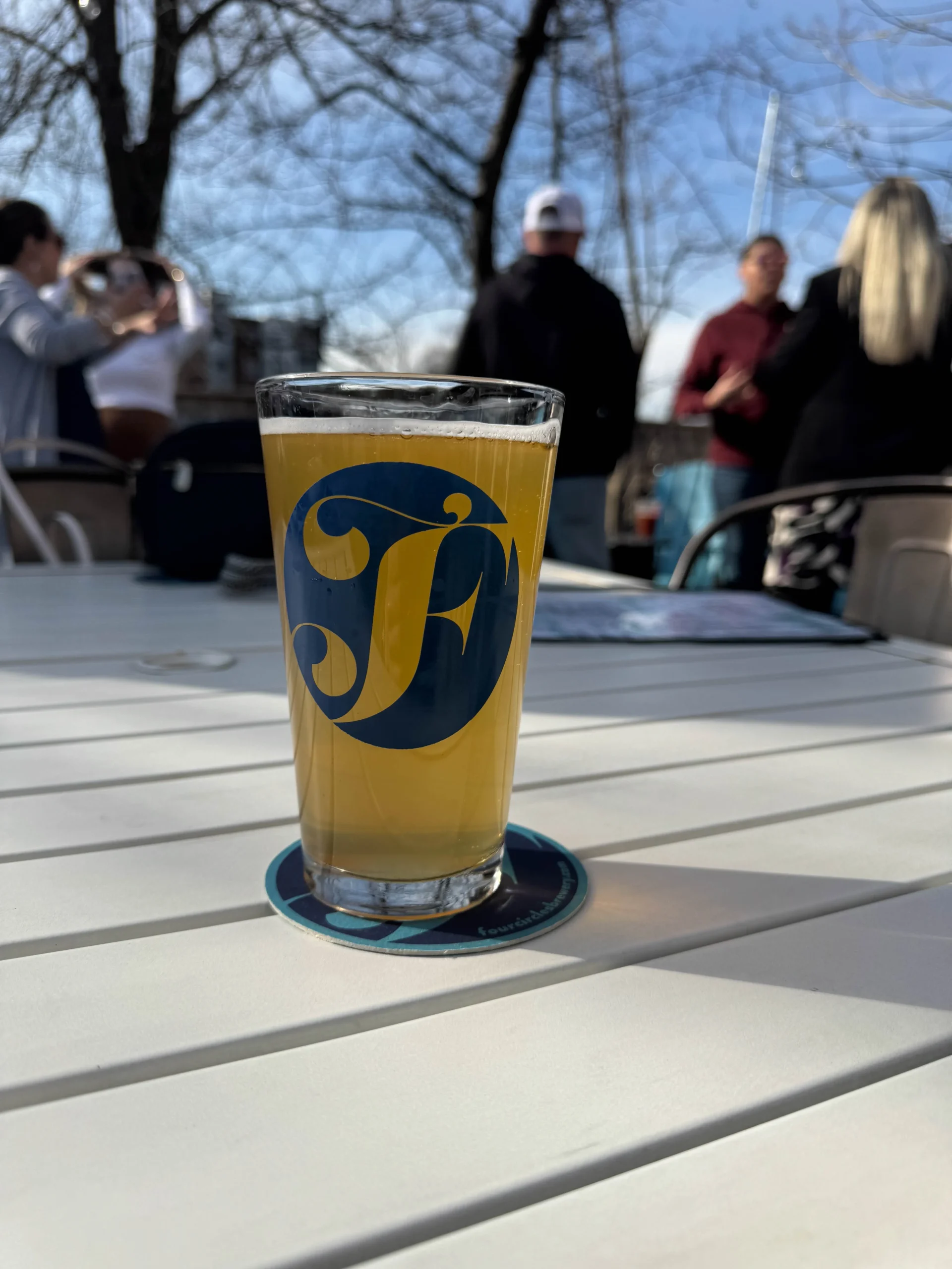 Four Circles Brewery beer outside on patio in downtown Brighton