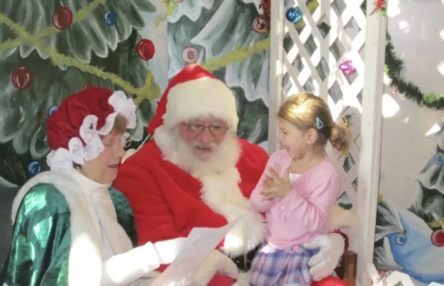 A little girl with Santa at Howell Nature Center