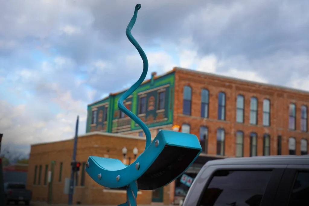 sculpture and mural overlooking the downtown howell landscape