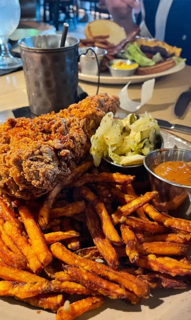 Fried Chicken and Sweet Potato fries meal at single barrel social in Brighton