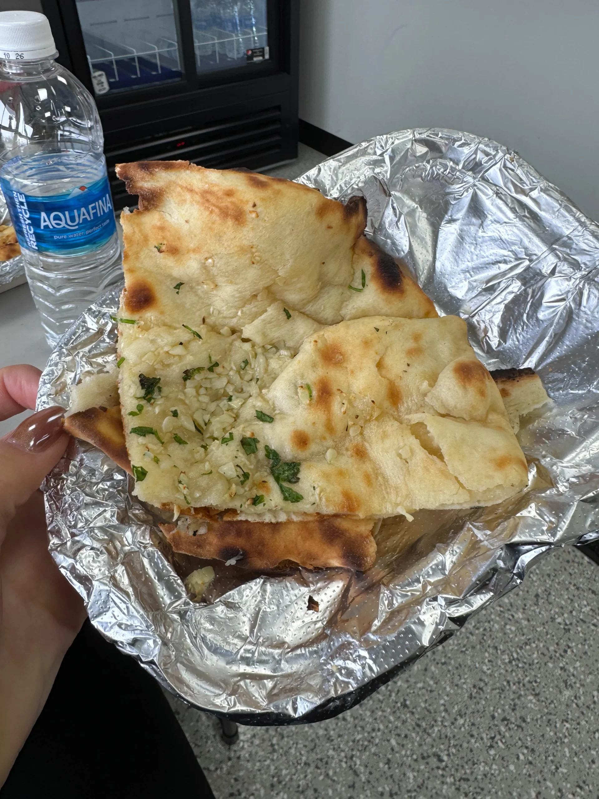 AG's Indian Cuisine garlic bread and curry.