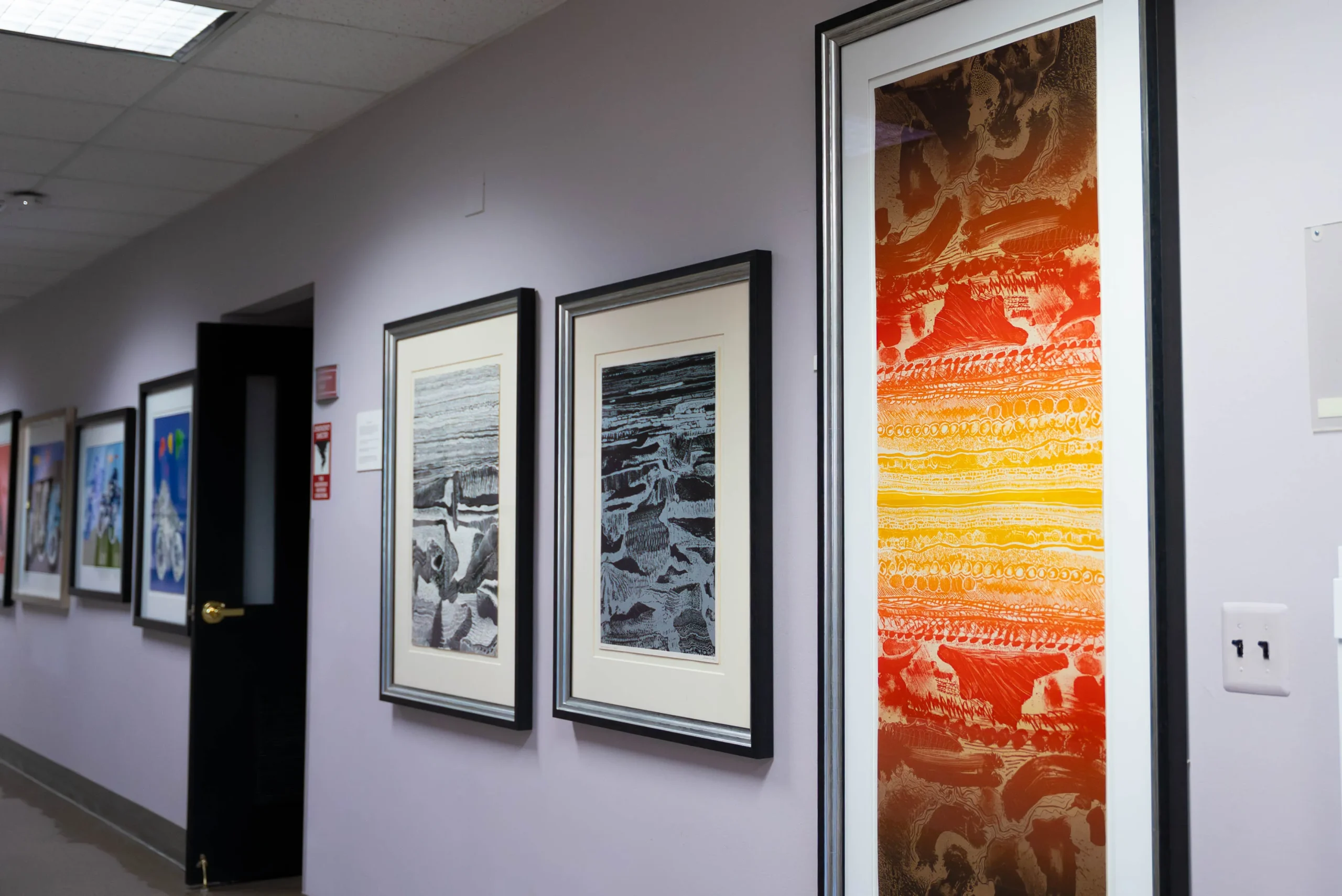 Arthur Secunda Museum paintings on wall in Howell.