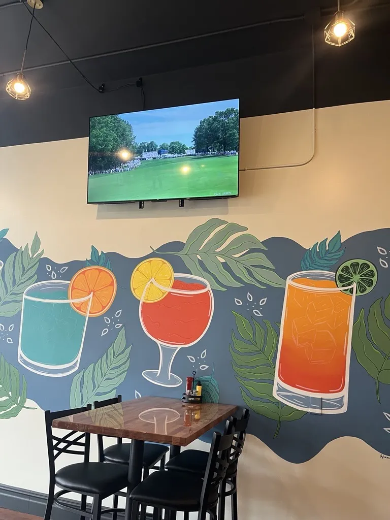 SunnySips Bar & Grill drink mural inside the restaurant in Howell