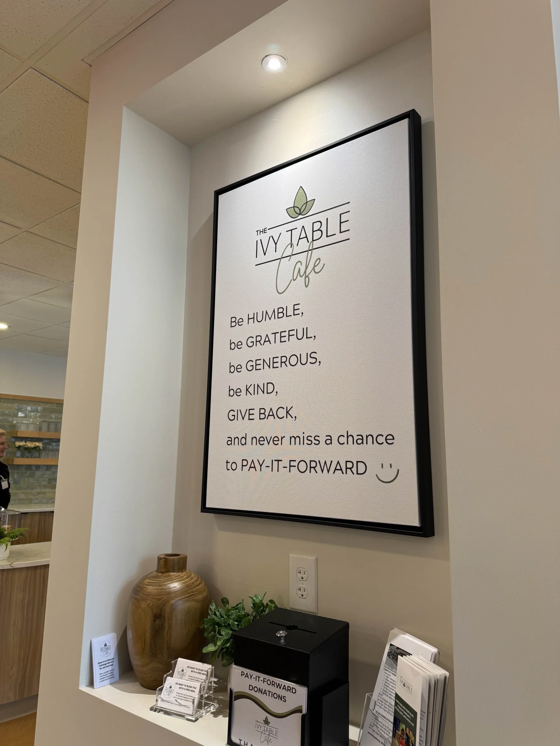 The Ivy Table sayings on poster in hallway at cafe in Brighton.