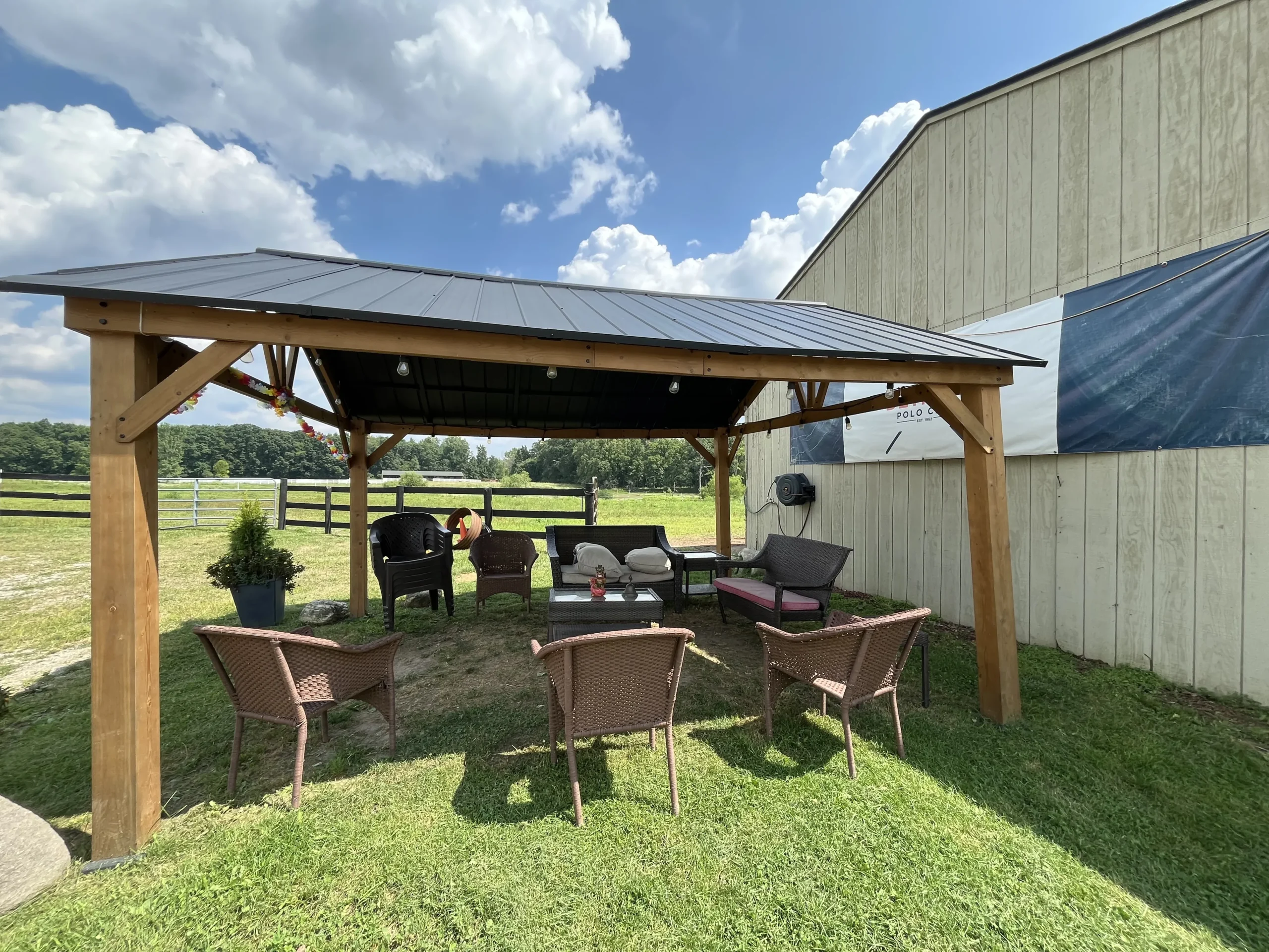 Detroit Polo Club outside seating area under awning in Hartland.